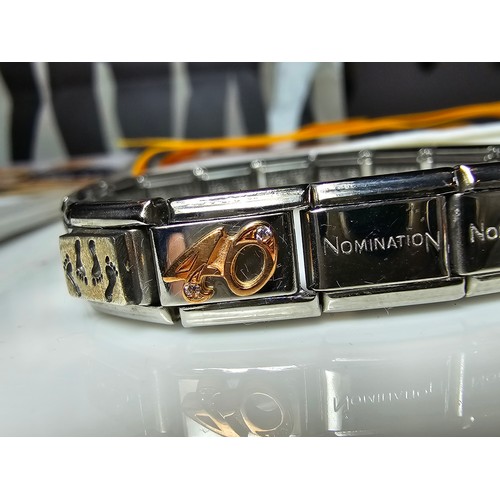 314 - A good quality unused designer panel bracelet by nomination Italy which includes 2 charm panels, the... 