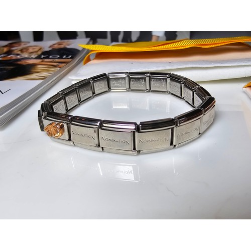 314 - A good quality unused designer panel bracelet by nomination Italy which includes 2 charm panels, the... 