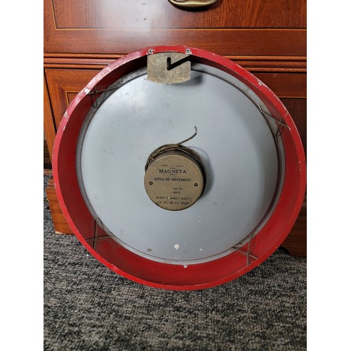 461 - Vintage Magneta electric impulse movement wall clock with a red metal surround. diameter of 32cm