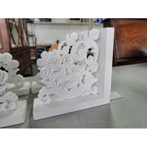 467 - Box containing 4x matching wooden floral scroll design shlef supports along with a 3 tier ceiling li... 