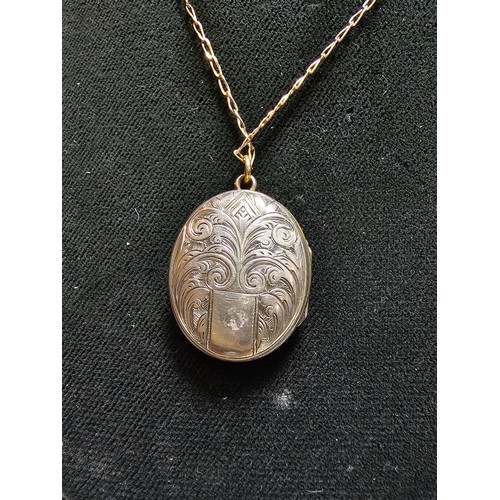 316 - An antique good quality mourning locket on an 18