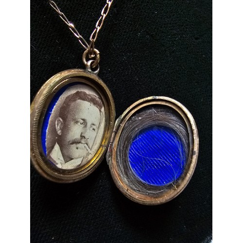 316 - An antique good quality mourning locket on an 18