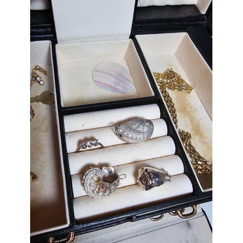 317 - A good quality leather type jewellery storage box containing a good quantity of costume jewellery wh... 