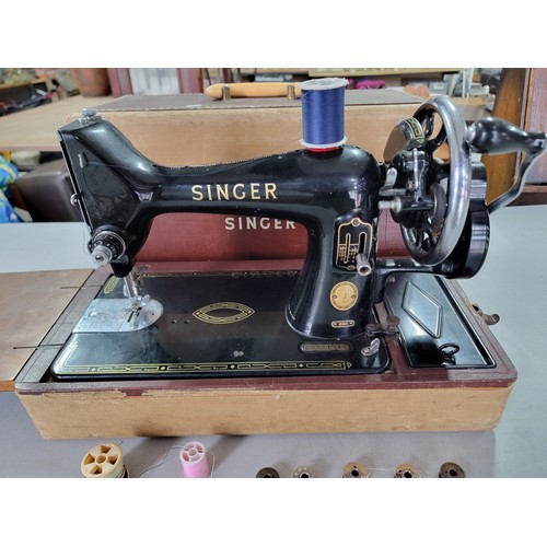 476 - Cased vintage singer sewing machine model 99k EM351218 along with a quantity of spare bobbins, all i... 