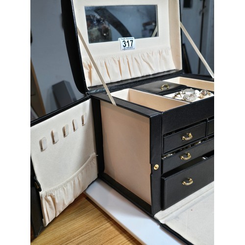 317 - A good quality leather type jewellery storage box containing a good quantity of costume jewellery wh... 