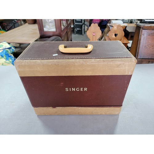 476 - Cased vintage singer sewing machine model 99k EM351218 along with a quantity of spare bobbins, all i... 