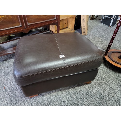 493 - Faux leather storage pouffe in overall good condition with lift up top to reveal storage standing on... 