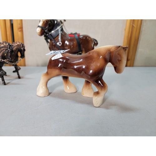 323 - We have a copper Roman model of a 2 horse driven chariot with a Roman figure on board along with 2 c... 