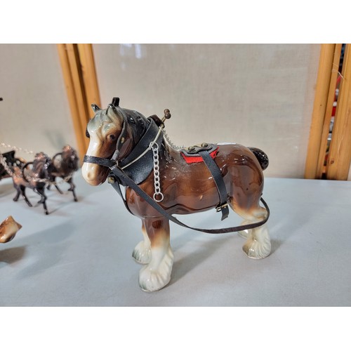 323 - We have a copper Roman model of a 2 horse driven chariot with a Roman figure on board along with 2 c... 