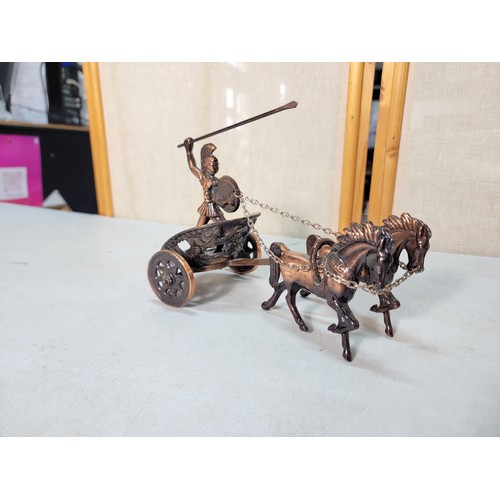 323 - We have a copper Roman model of a 2 horse driven chariot with a Roman figure on board along with 2 c... 