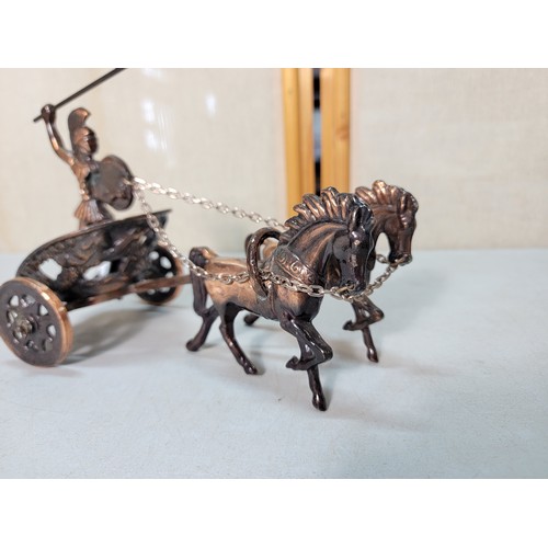 323 - We have a copper Roman model of a 2 horse driven chariot with a Roman figure on board along with 2 c... 