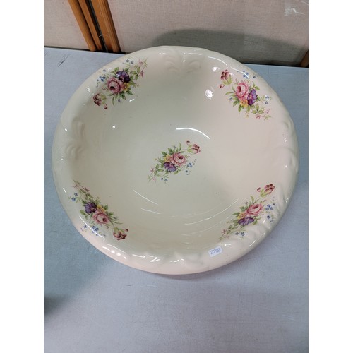 327 - A large vintage ceramic jug and bowl with a hand decorated floral design by Long Mead in excellent c... 