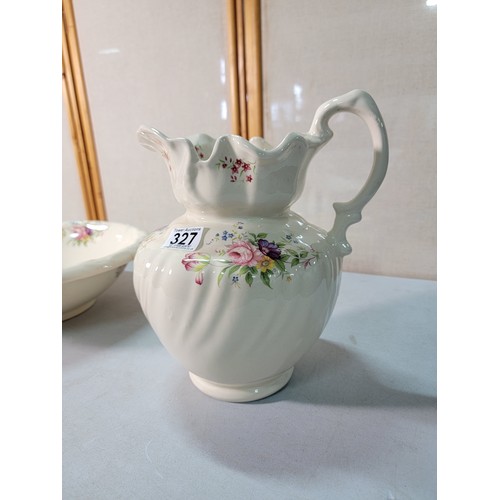 327 - A large vintage ceramic jug and bowl with a hand decorated floral design by Long Mead in excellent c... 