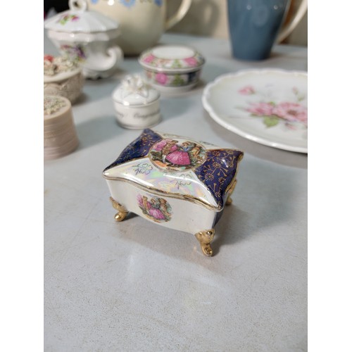 325 - A shelf full of collectable ceramic to include a good Victorian black lidded jug with a gilt design ... 