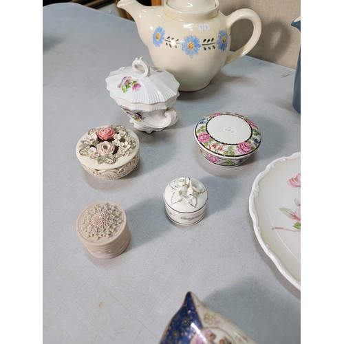 325 - A shelf full of collectable ceramic to include a good Victorian black lidded jug with a gilt design ... 