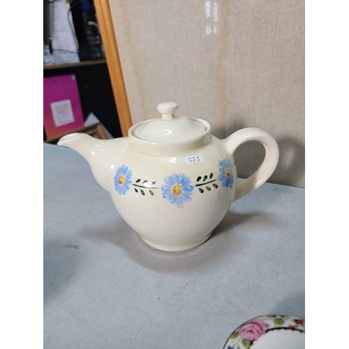 325 - A shelf full of collectable ceramic to include a good Victorian black lidded jug with a gilt design ... 