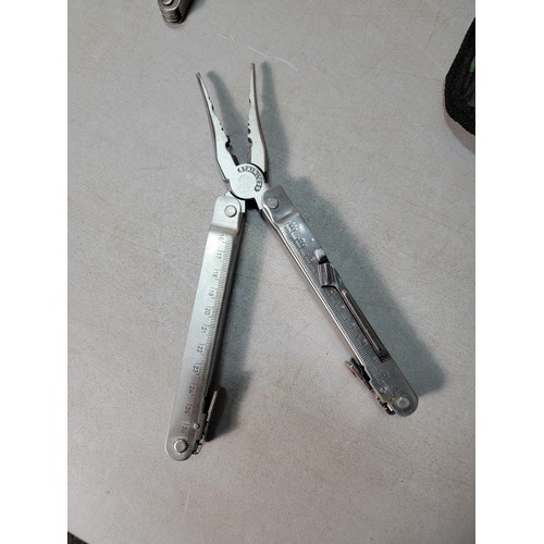 261 - A large good quality multi tool by Boyz Toys to include a pair of pliers, saw, compass, scissors, 2 ... 