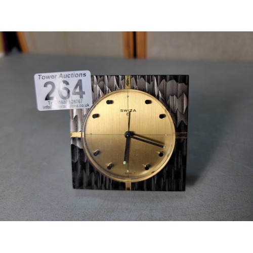 264 - A Swiza 8 mechanical travel alarm clock having an ornate design, in good condition, the clock has be... 