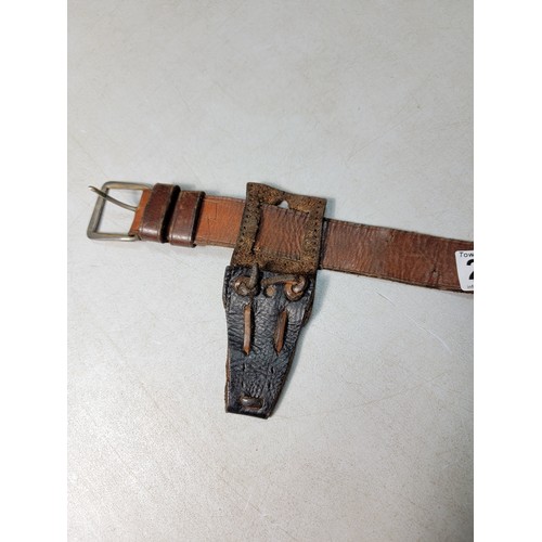 265 - A good quality early vintage or antique full leather handgun holster on a leather belt of good quali... 