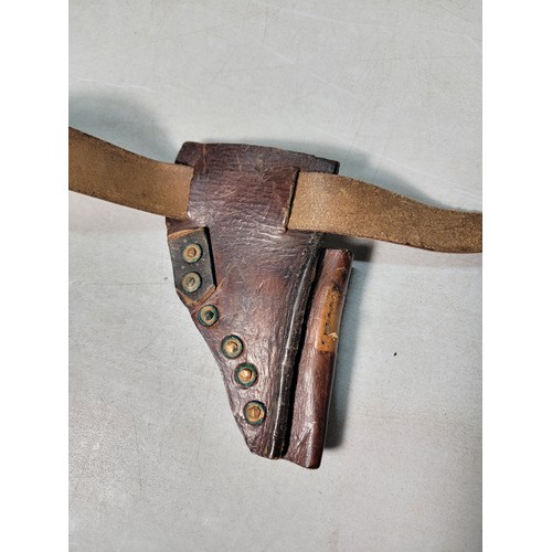 265 - A good quality early vintage or antique full leather handgun holster on a leather belt of good quali... 