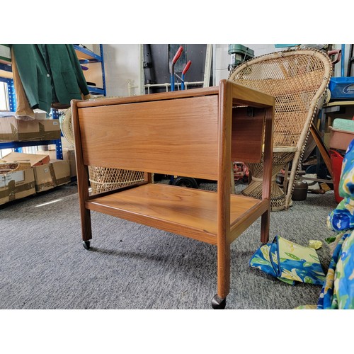 489 - Mid Century Teak drop leaf hostess trollely standing on 4x castors, has a shelf to the base. Height ... 