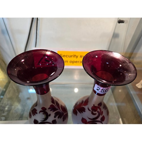 256 - A pair of stunning antique hand blown bohemian type ruby glass vases with an etched stag and doe sce... 