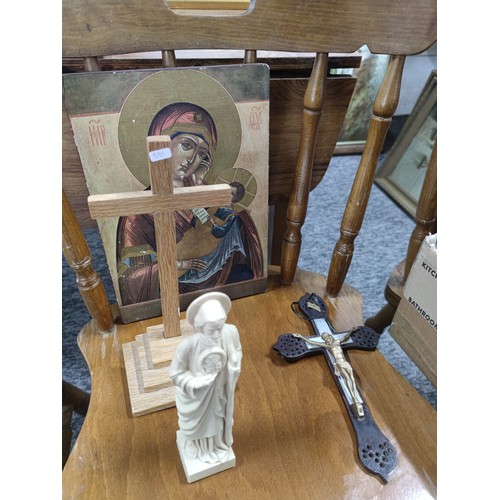 82 - A quantity of various Catholic items to include a Crucifix, painting on board, a Bible, candle holde... 