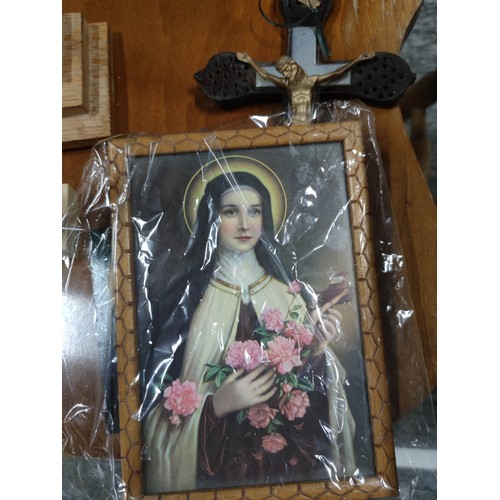 82 - A quantity of various Catholic items to include a Crucifix, painting on board, a Bible, candle holde... 