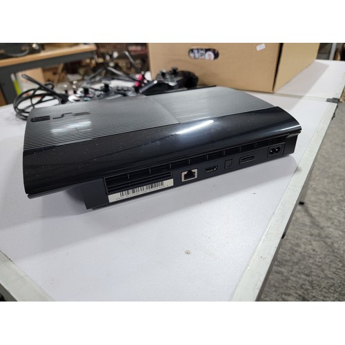 2 - Playstation 3 ultra slim along with a  2x controllers, quantity of games to inc fifa, tomb rader etc... 