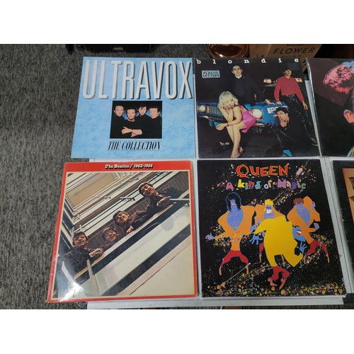 10 - Small quantity of 6x LP's inc The Beatles, Queen, The Stranglers, along with 4x 45's inc Queen, Comm... 