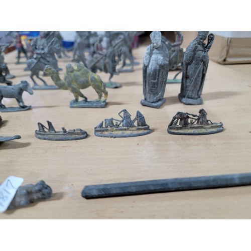 13 - A large quantity of flat back lead figurines inc military figures, animals, boats, cannons etc, all ... 