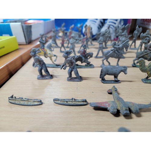 13 - A large quantity of flat back lead figurines inc military figures, animals, boats, cannons etc, all ... 