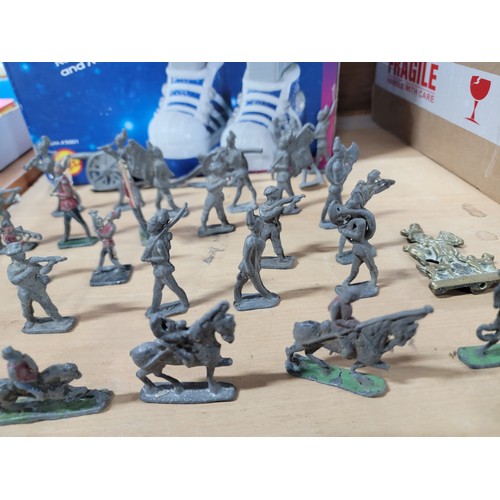 13 - A large quantity of flat back lead figurines inc military figures, animals, boats, cannons etc, all ... 