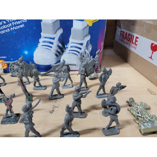 13 - A large quantity of flat back lead figurines inc military figures, animals, boats, cannons etc, all ... 