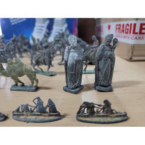 13 - A large quantity of flat back lead figurines inc military figures, animals, boats, cannons etc, all ... 