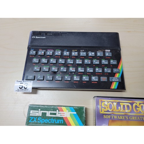 56 - A Sinclair ZX Spectrum including a selection of games inc Count Duckula, Gobble a Ghost, Scrabble et... 