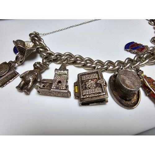 332 - Good quality vintage sterling silver charm bracelet containing 12x sterling silver charms which incl... 