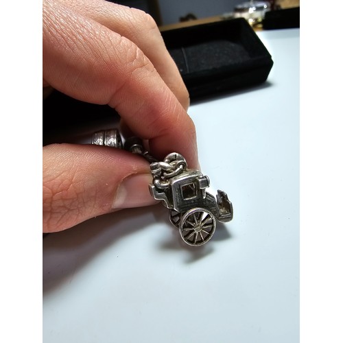 332 - Good quality vintage sterling silver charm bracelet containing 12x sterling silver charms which incl... 