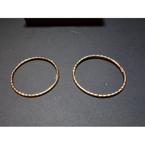 339 - Pair of 9ct. yellow gold hoop earrings in excellent clean condition boxed. Total weight 0.8g.