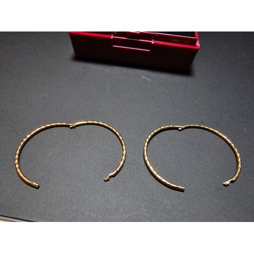 339 - Pair of 9ct. yellow gold hoop earrings in excellent clean condition boxed. Total weight 0.8g.