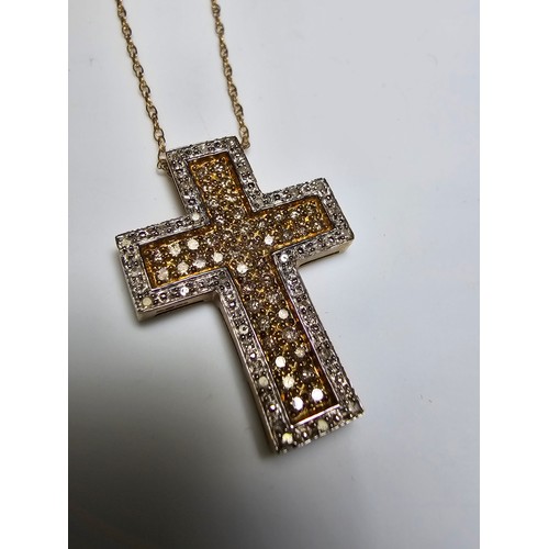 361 - Stunning 9ct yellow gold cross pendant encrusted with 70 diamonds 44 diamonds on the inside with yel... 