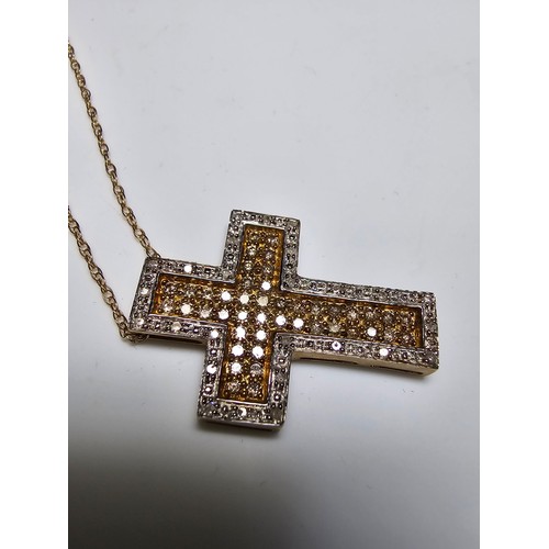 361 - Stunning 9ct yellow gold cross pendant encrusted with 70 diamonds 44 diamonds on the inside with yel... 