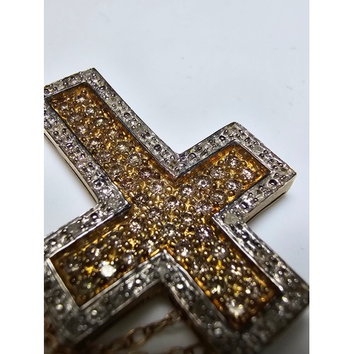 361 - Stunning 9ct yellow gold cross pendant encrusted with 70 diamonds 44 diamonds on the inside with yel... 