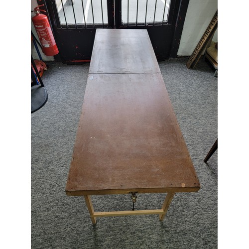 129 - Good quality fold up pasting / car boot table in overall good condition with metal braces to the leg... 