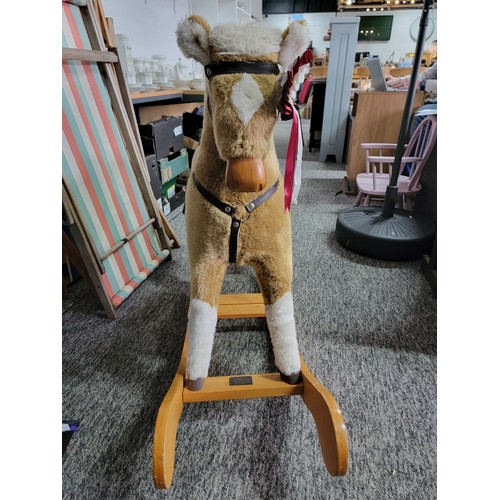 130 - Good quality Mamas & Papas rocking horse, complete with saddle, stirrups and rosette in its ear, sta... 