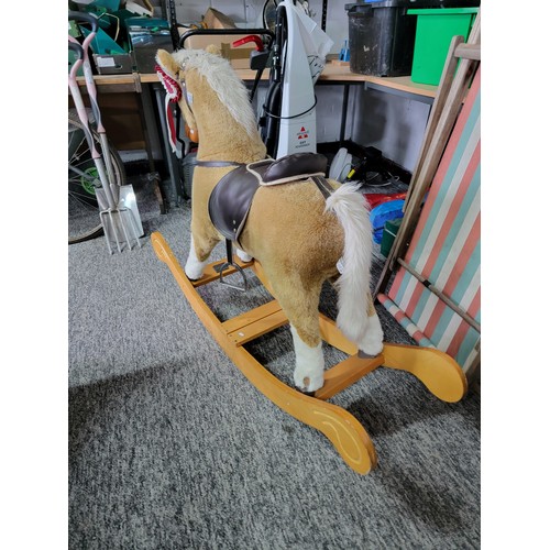 130 - Good quality Mamas & Papas rocking horse, complete with saddle, stirrups and rosette in its ear, sta... 