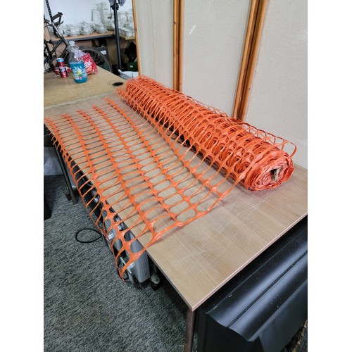 136 - Large roll of orange plastic mesh fencing ideal for construction sites