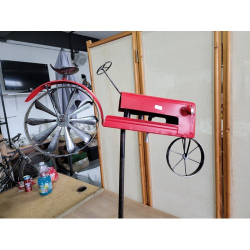 137 - A Welcome metal tractor garden stake with a rotational back wheel that turns in the wind in good ove... 