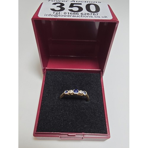 350 - An 18ct yellow gold 5 stone ring inset with 3 blue sapphire stones and 2 diamond stones in platinum ... 