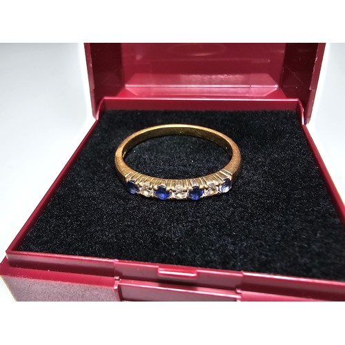 351 - A good quality hallmarked 18ct yellow gold 7 stone ring inset with 3 diamond stones and 4 sapphire s... 